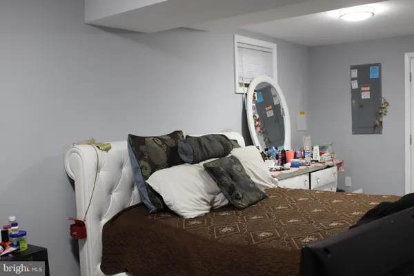 a living room with furniture and a clock