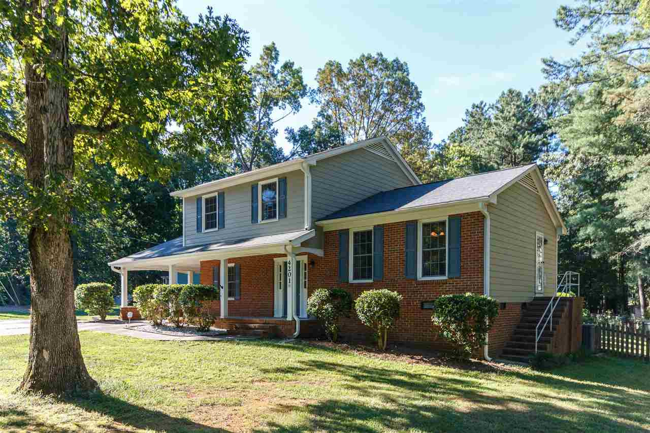 Beautiful trees. Well maintained home with 2015 Roof with architechural shingles, new hardiplank siding & gutters with leaf guards. Exterior Side