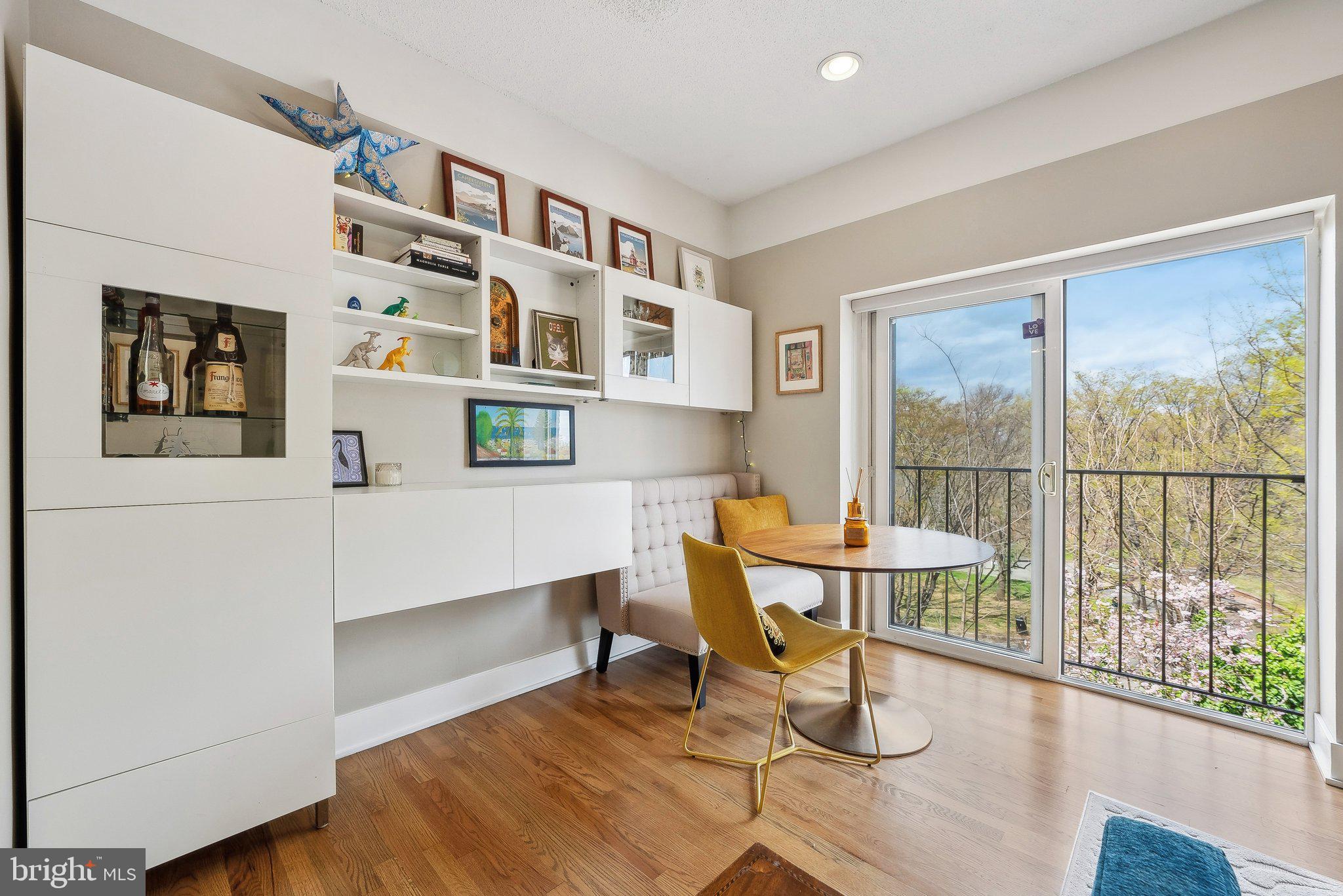 2630 Adams Mill Road Northwest, Unit 303 Washington, DC 20009 - Photo 2 of 18 a living room with furniture and a window