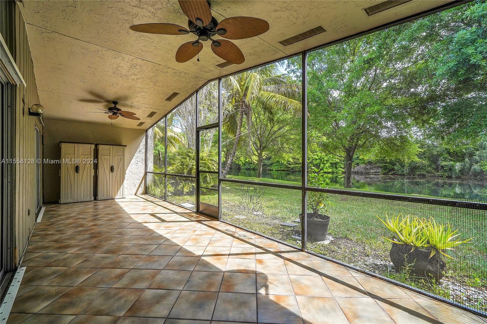 616 Woodgate Circle, Unit D Sunrise, FL 33326 - Photo 12 of 15 a view of a house with a porch