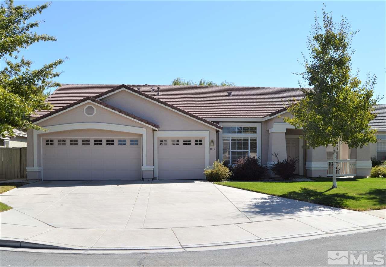 1170 Broadview Court Reno, NV 89521 - Photo 1 of 25 a front view of a house with a garden and trees