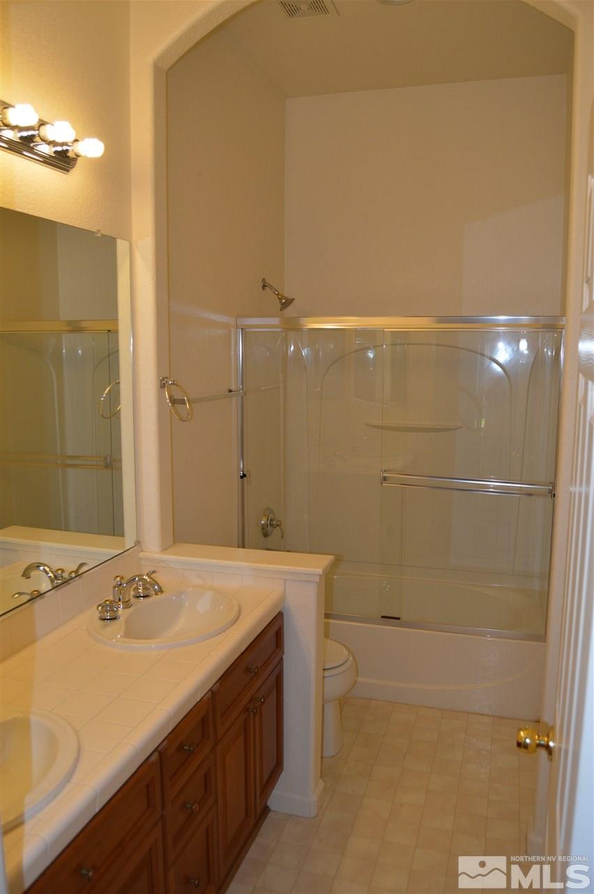 1170 Broadview Court Reno, NV 89521 - Photo 12 of 25 a bathroom with a sink a toilet and shower