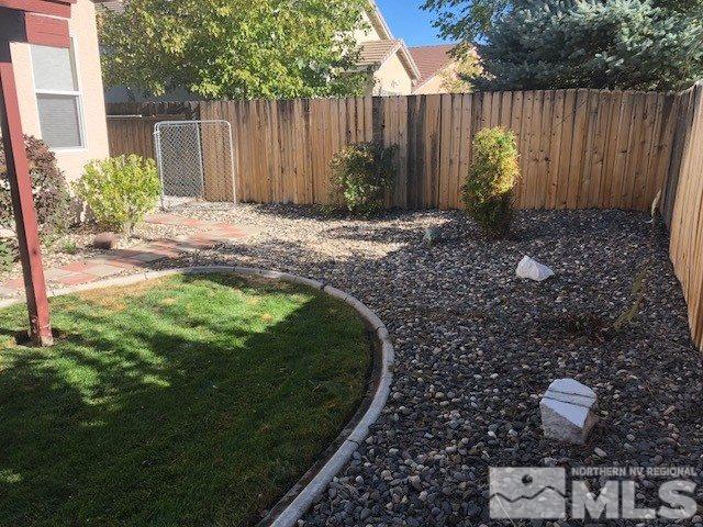 1170 Broadview Court Reno, NV 89521 - Photo 22 of 25 a backyard of a house with lots of green space