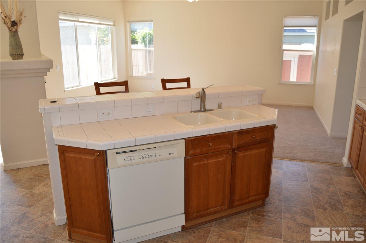1170 Broadview Court Reno, NV 89521 - Photo 6 of 25 a utility room with a sink washer and dryer