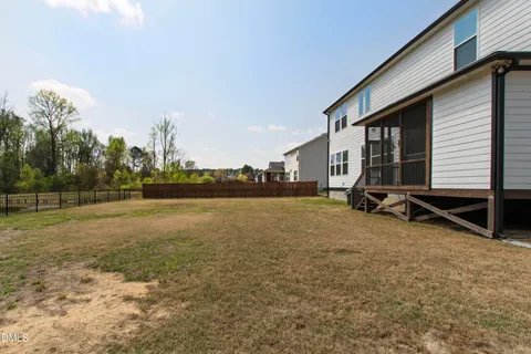 an aerial view of a house with roof deck front of house