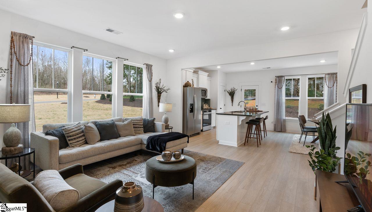 Great Room, Kitchen & Dining Room are all open-concept for entertaining. *Model Home-For illustrative purposes only*