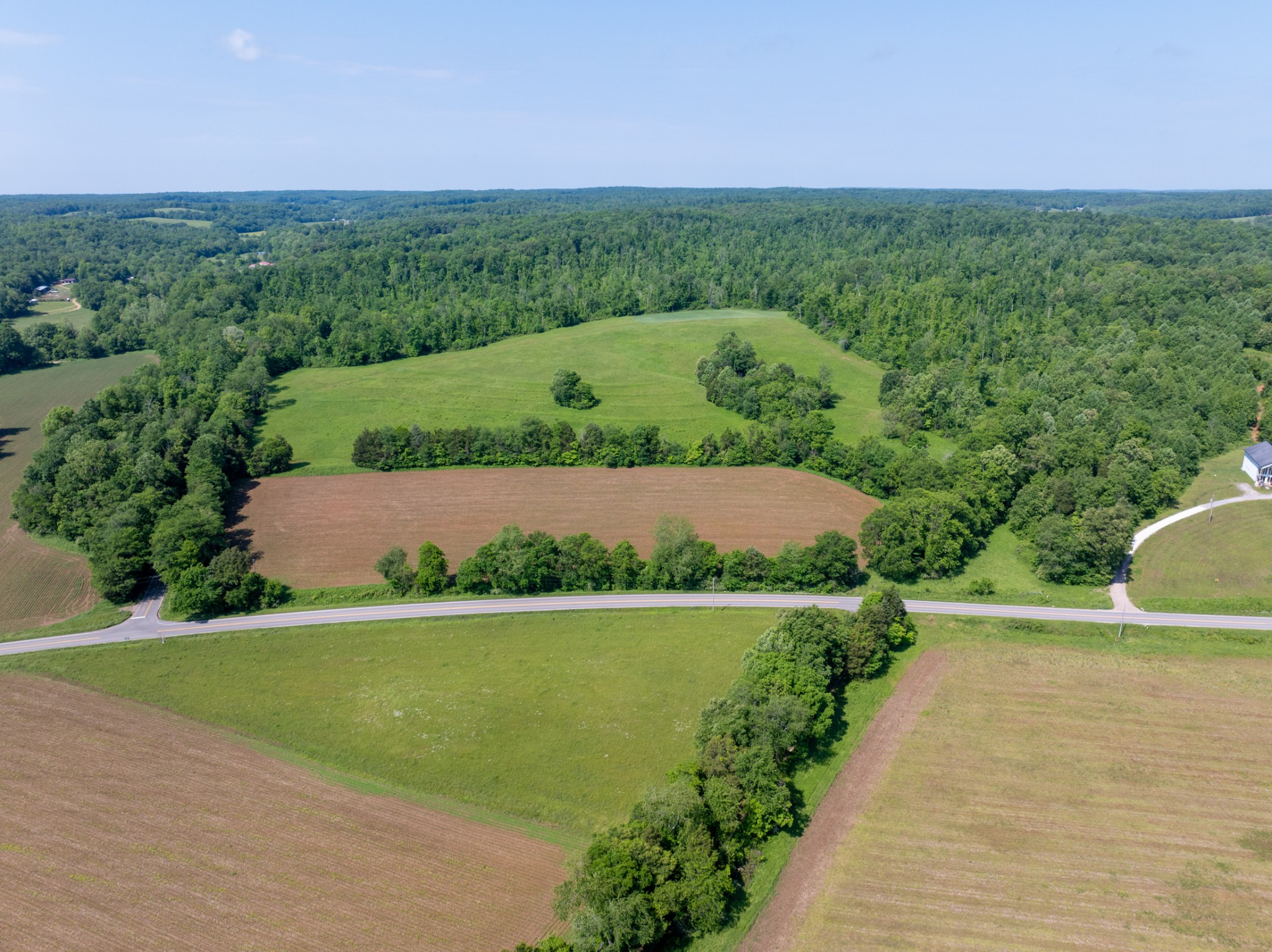 3 Highway 49 Vanleer, TN 37181 - Photo 4 of 26 a view of a garden with a building in the background