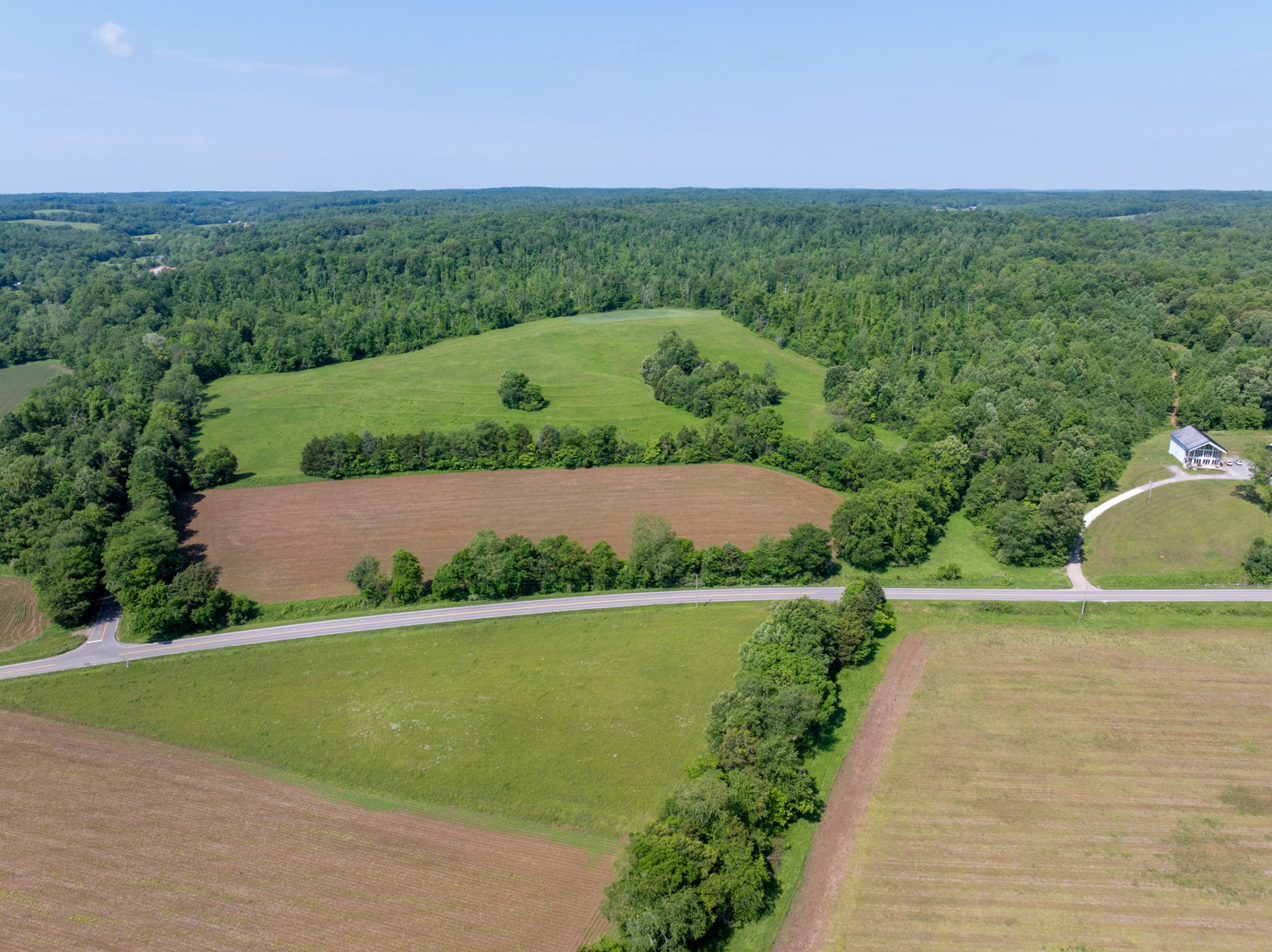 3 Highway 49 Vanleer, TN 37181 - Photo 9 of 26 a view of a city with lush green forest