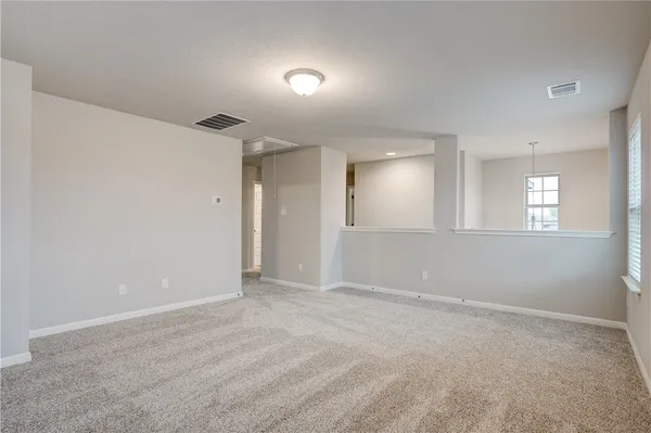 an empty room with closet area