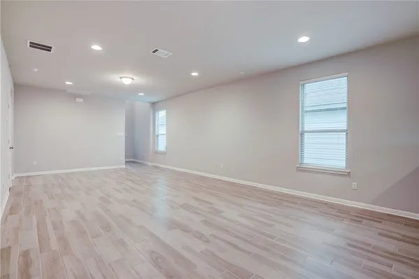 a kitchen with granite countertop a stove a sink and a microwave