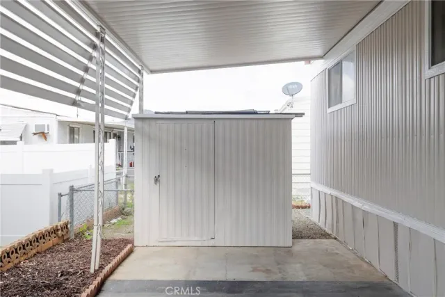 a view of a porch with wooden floor