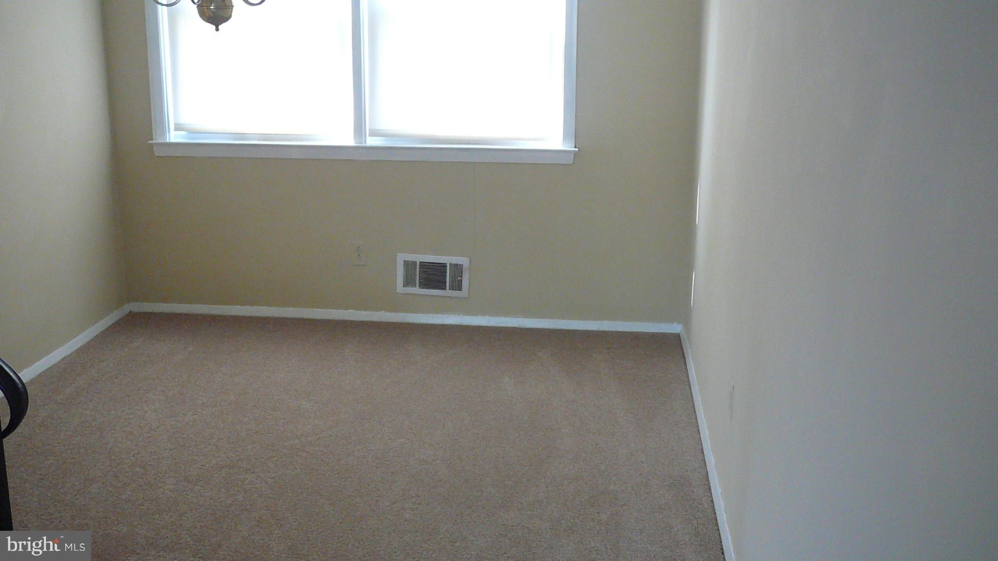 2127 Southorn Road Baltimore, MD 21220 - Photo 5 of 11 an empty room with a window