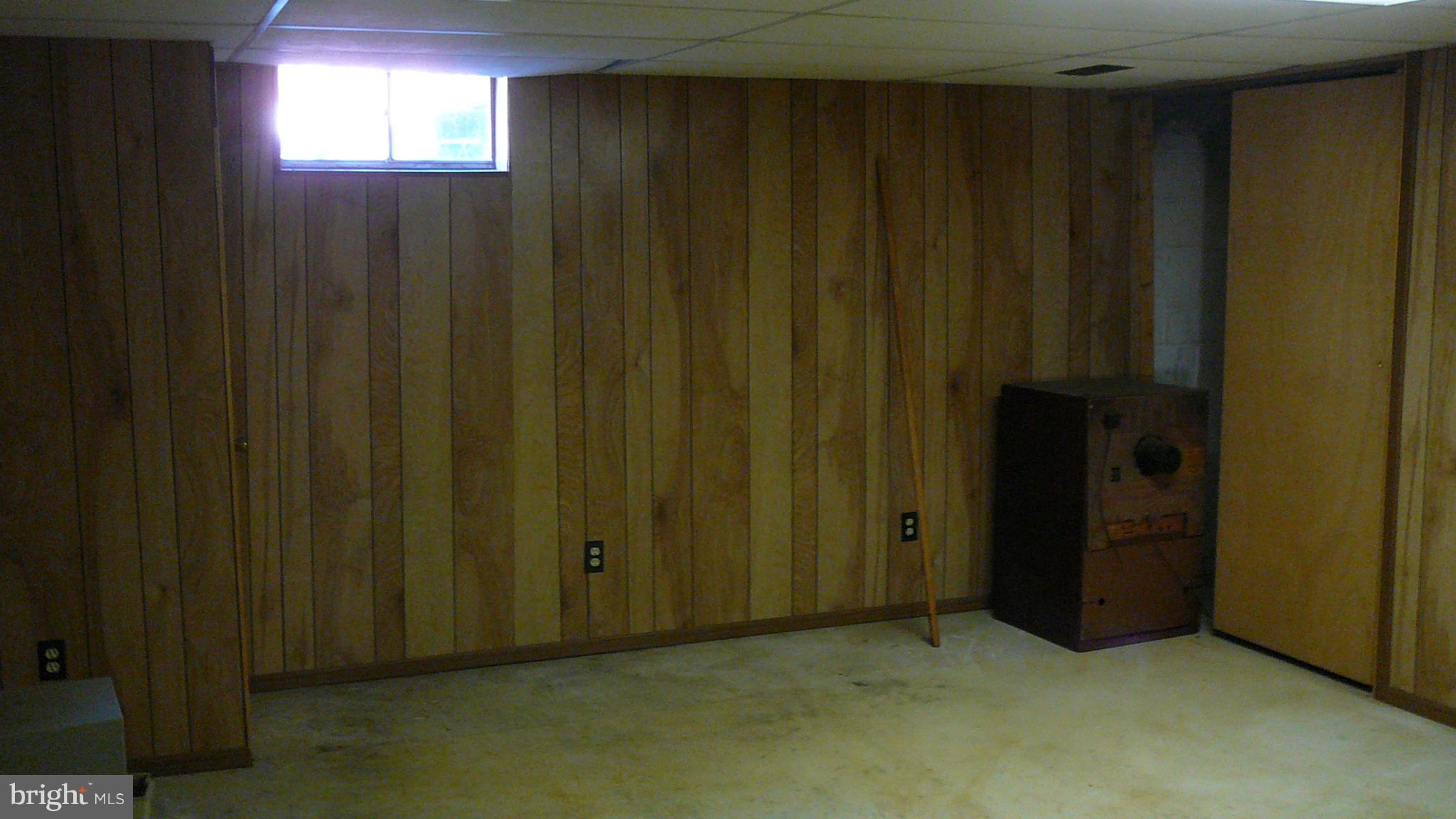 2127 Southorn Road Baltimore, MD 21220 - Photo 9 of 11 a view of an empty room with wooden walls