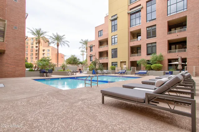 a view of a swimming pool with a lounge chair