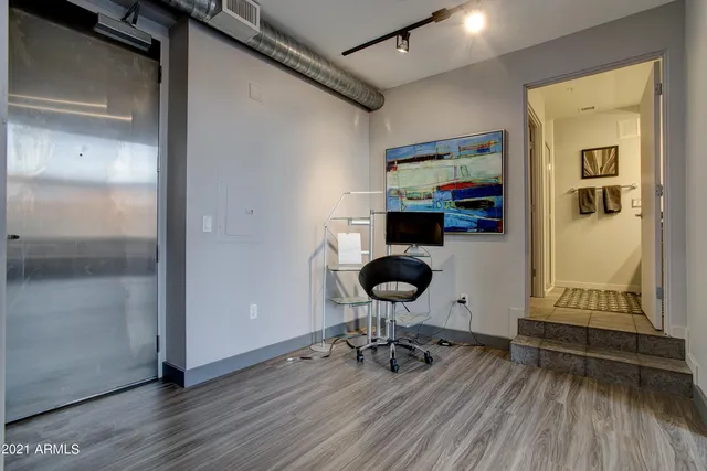 a view of dining room with wooden floor and furniture