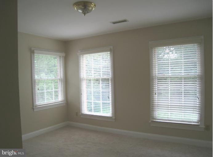 10118 Colvin Run Road Great Falls, VA 22066 - Photo 2 of 26 a view of an empty room with a window