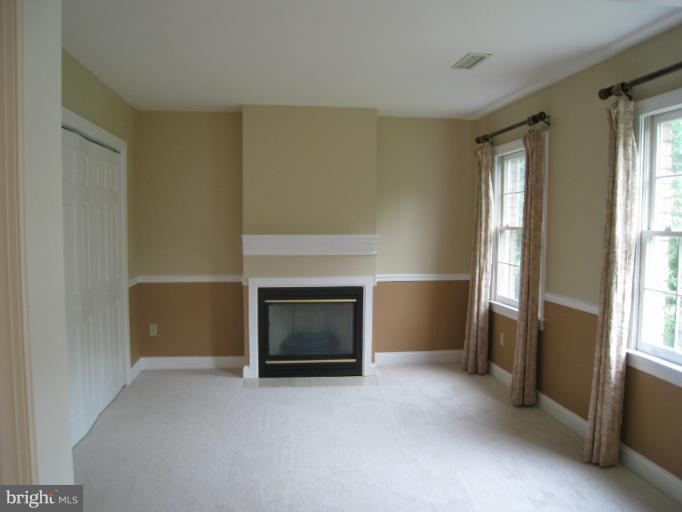 10118 Colvin Run Road Great Falls, VA 22066 - Photo 17 of 26 a view of empty room with a fireplace
