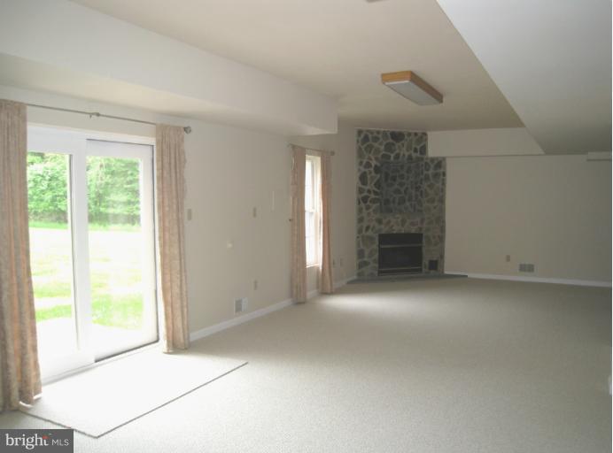 10118 Colvin Run Road Great Falls, VA 22066 - Photo 20 of 26 a view of empty room with a fireplace