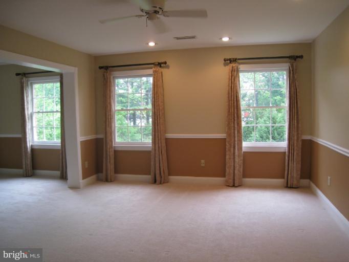10118 Colvin Run Road Great Falls, VA 22066 - Photo 21 of 26 a view of an empty room with a window