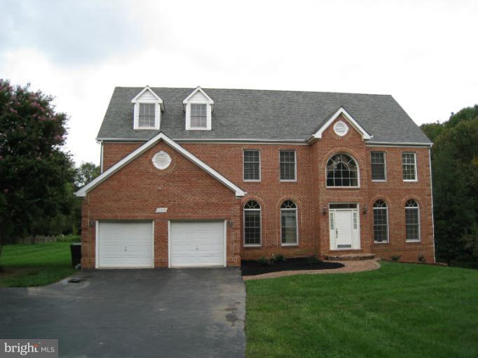10118 Colvin Run Road Great Falls, VA 22066 - Photo 26 of 26 a front view of a house with a garden