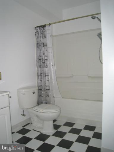 10118 Colvin Run Road Great Falls, VA 22066 - Photo 4 of 26 a bathroom with a toilet and a shower