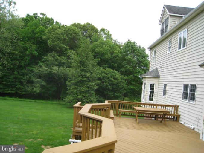 10118 Colvin Run Road Great Falls, VA 22066 - Photo 9 of 26 a view of a house with a roof deck