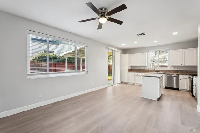 a view of kitchen with sink and wooden floor