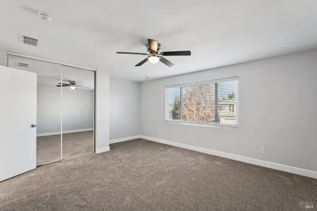 a bathroom with a double vanity sink toilet mirror and bathtub