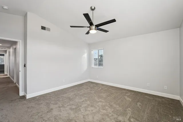 a bathroom with double vanity sinks and a bathtub