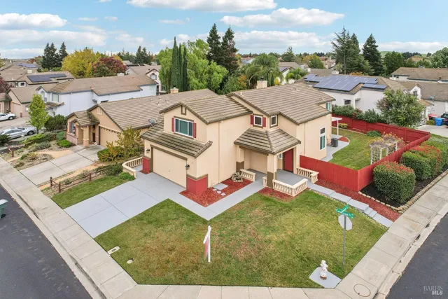 an aerial view of a city with mountains
