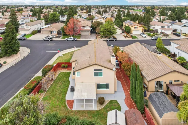 an aerial view of residential houses with outdoor space