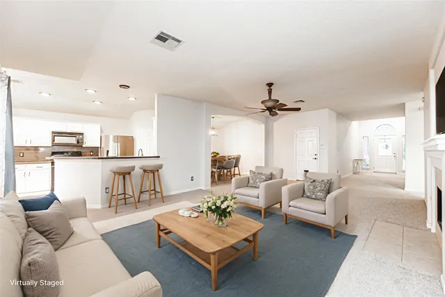 a living room with furniture and a table