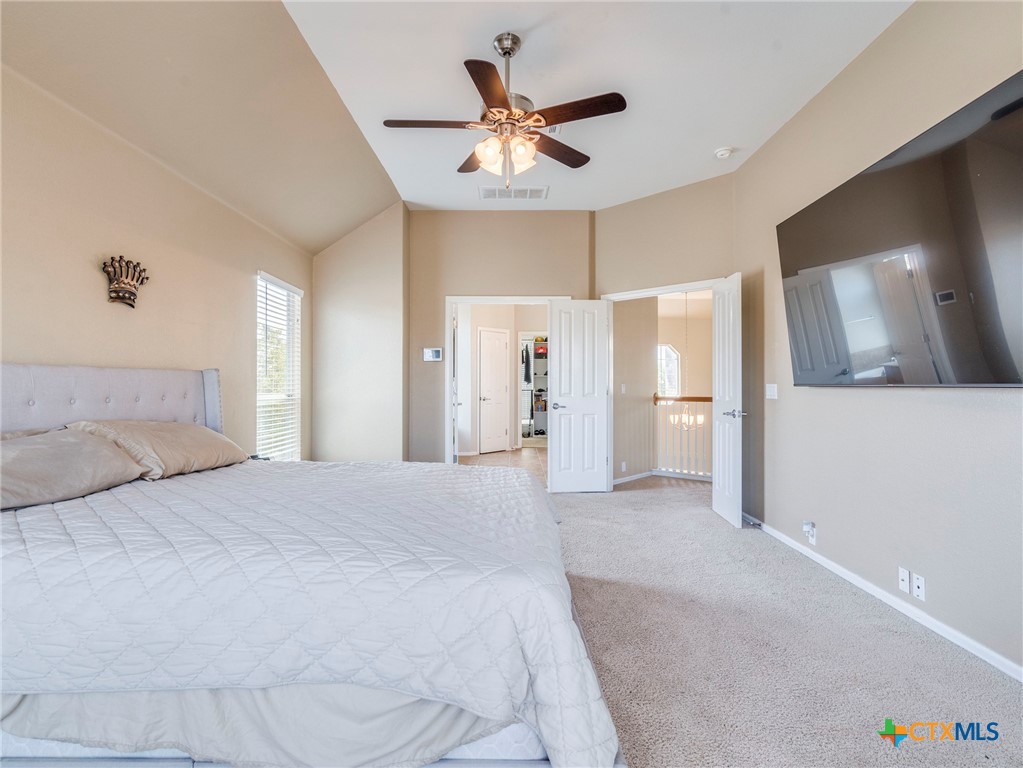 125 Sweet Gum Drive Kyle, TX 78640 - Photo 18 of 31 a large white bed in a white room