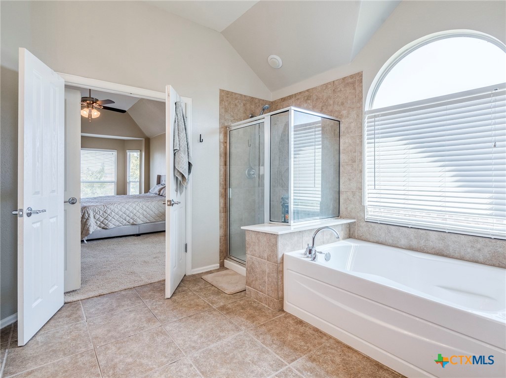 125 Sweet Gum Drive Kyle, TX 78640 - Photo 20 of 31 a spacious bathroom with a tub and a large window