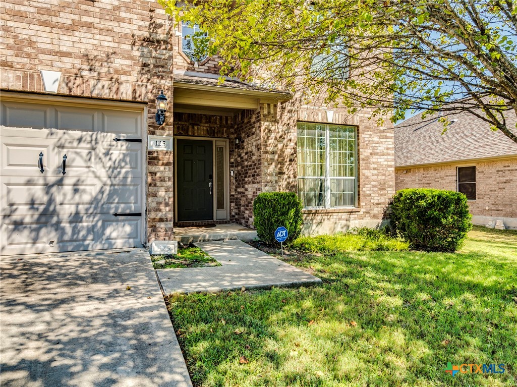 125 Sweet Gum Drive Kyle, TX 78640 - Photo 4 of 31 a view of a front of a house with a small yard