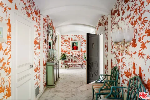 a bed room with a bed and a chair