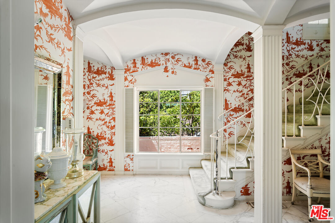 10934 Bellagio Road Los Angeles, CA 90077 - Photo 16 of 52 a bed room with a bed and a chair