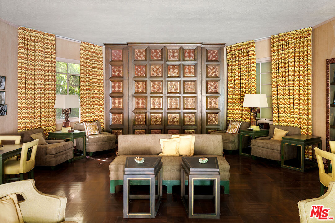 10934 Bellagio Road Los Angeles, CA 90077 - Photo 23 of 52 a living room with furniture and floor to ceiling windows