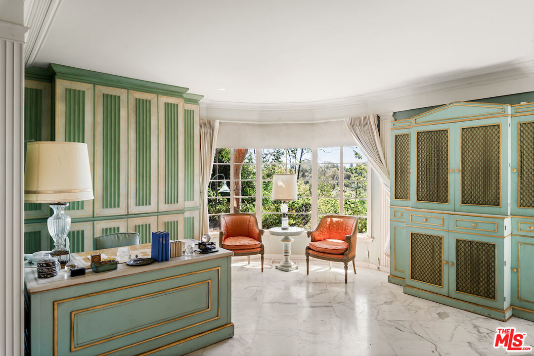 10934 Bellagio Road Los Angeles, CA 90077 - Photo 31 of 52 a room with furniture a flat screen tv and a large window