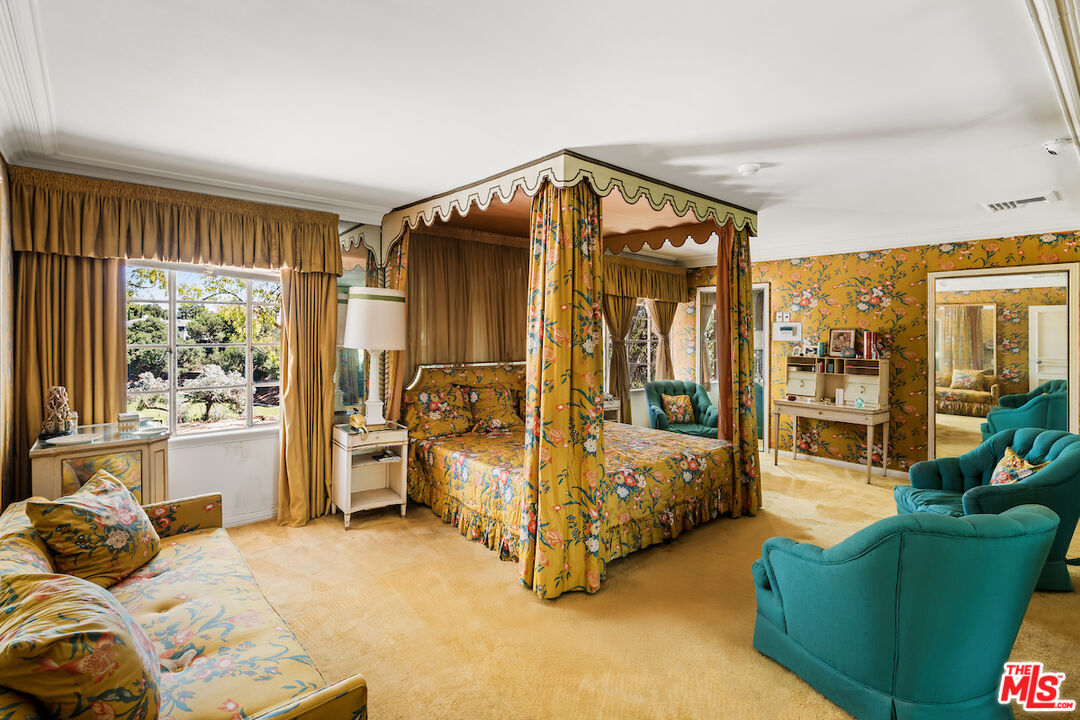 10934 Bellagio Road Los Angeles, CA 90077 - Photo 32 of 52 a bed room with a bed and a chair