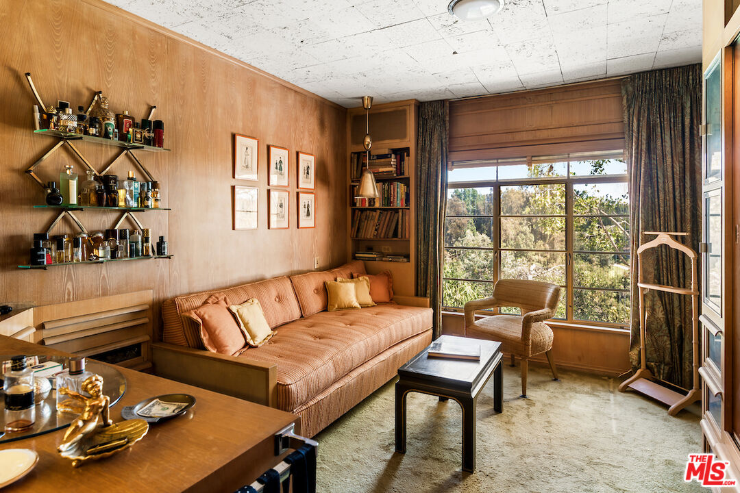 10934 Bellagio Road Los Angeles, CA 90077 - Photo 34 of 52 a living room with furniture and a flat screen tv