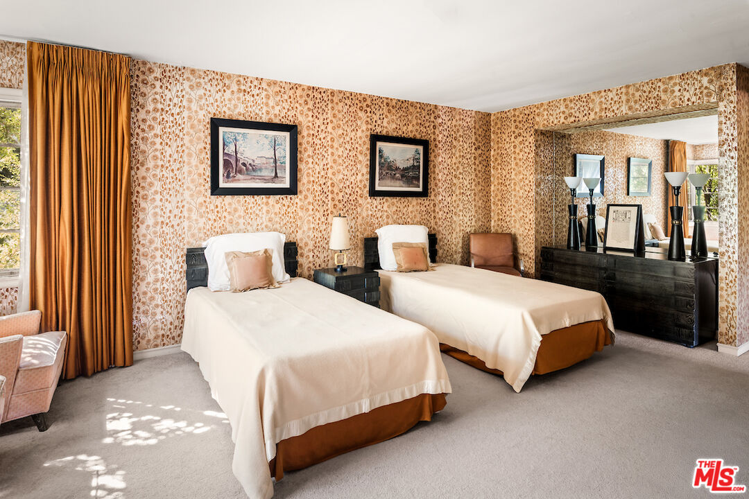 10934 Bellagio Road Los Angeles, CA 90077 - Photo 40 of 52 a bedroom with two beds and painting on the wall