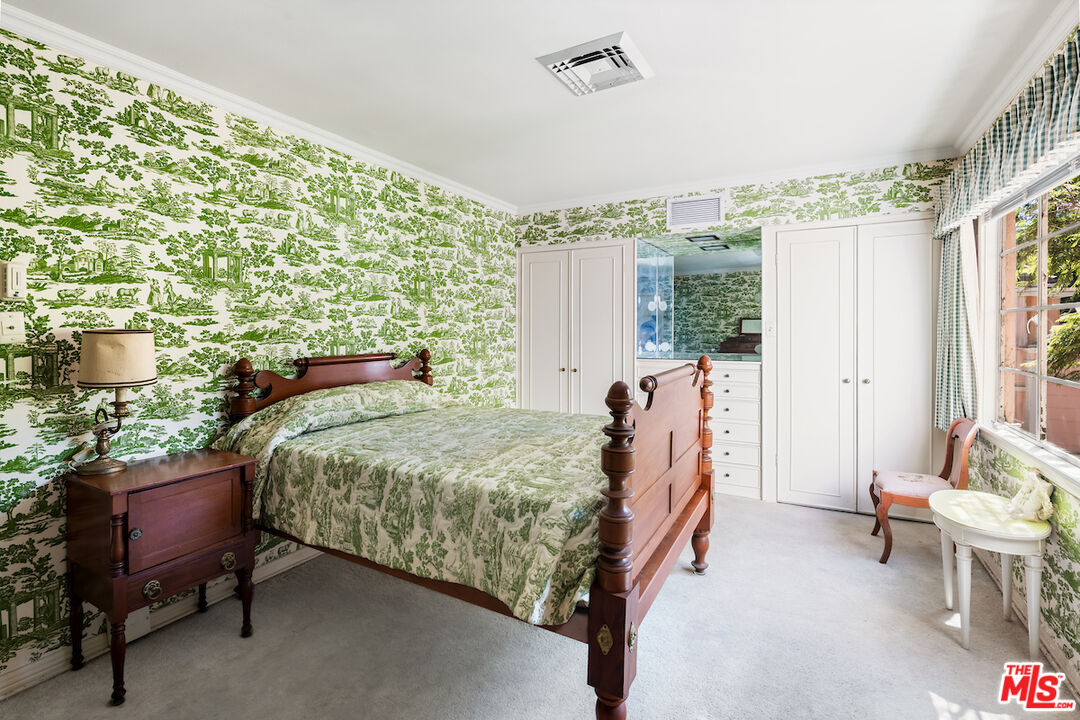 10934 Bellagio Road Los Angeles, CA 90077 - Photo 41 of 52 a bed room with a bed and a chair