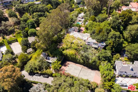 an aerial view of swimming pool and mountain