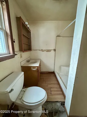 a bathroom with a toilet and a sink