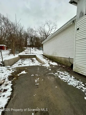 a view of a backyard of the house