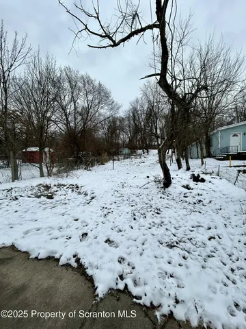 a view of a snow on the side of the road