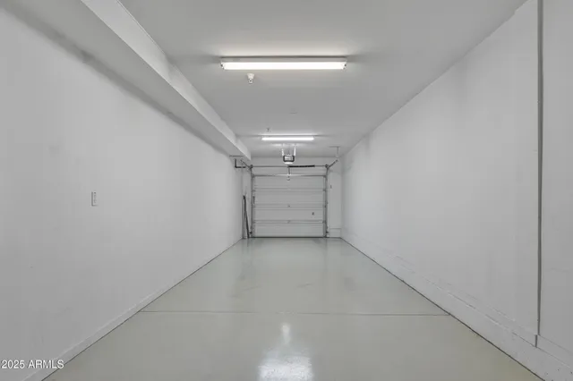 a kitchen with stainless steel appliances granite countertop a refrigerator a sink dishwasher a stove and a refrigerator with wooden floor