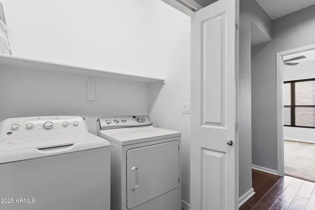 an empty room with closet and a chandelier fan