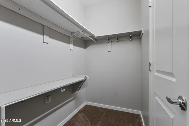 an empty room with closet area